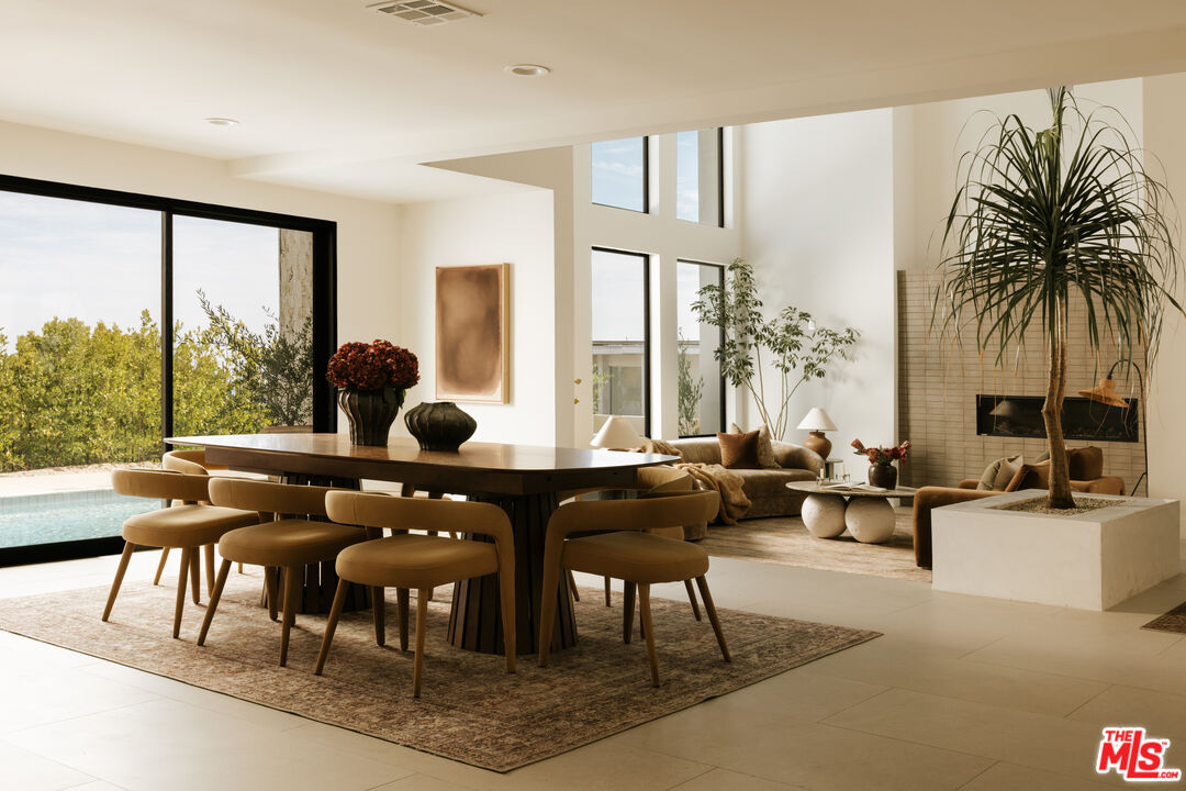 Dining room opening into the living spaces at Venus Drive
