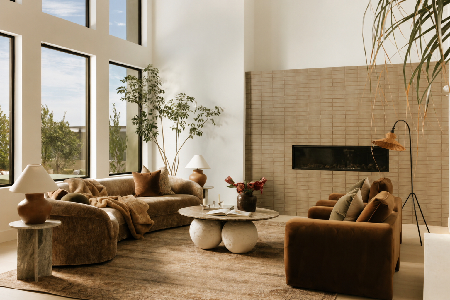 Main living room with tall windows and a tiled fireplace at Venus Drive